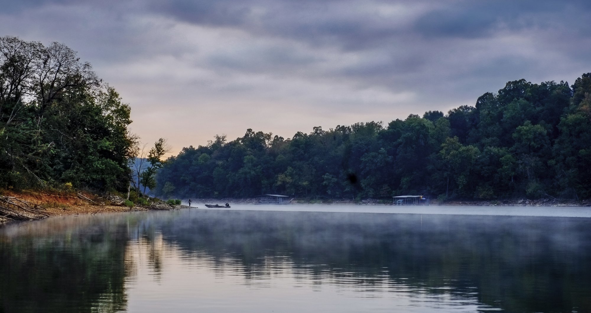 Mist rising over a lake at dawn